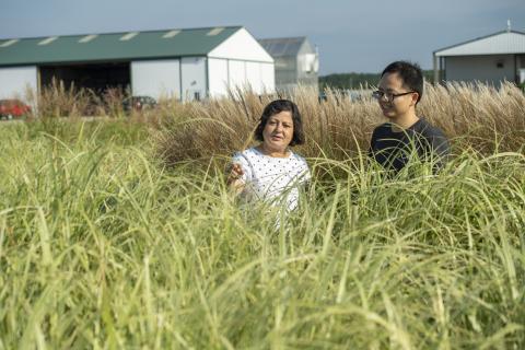 Madhu Khanna with student in grass